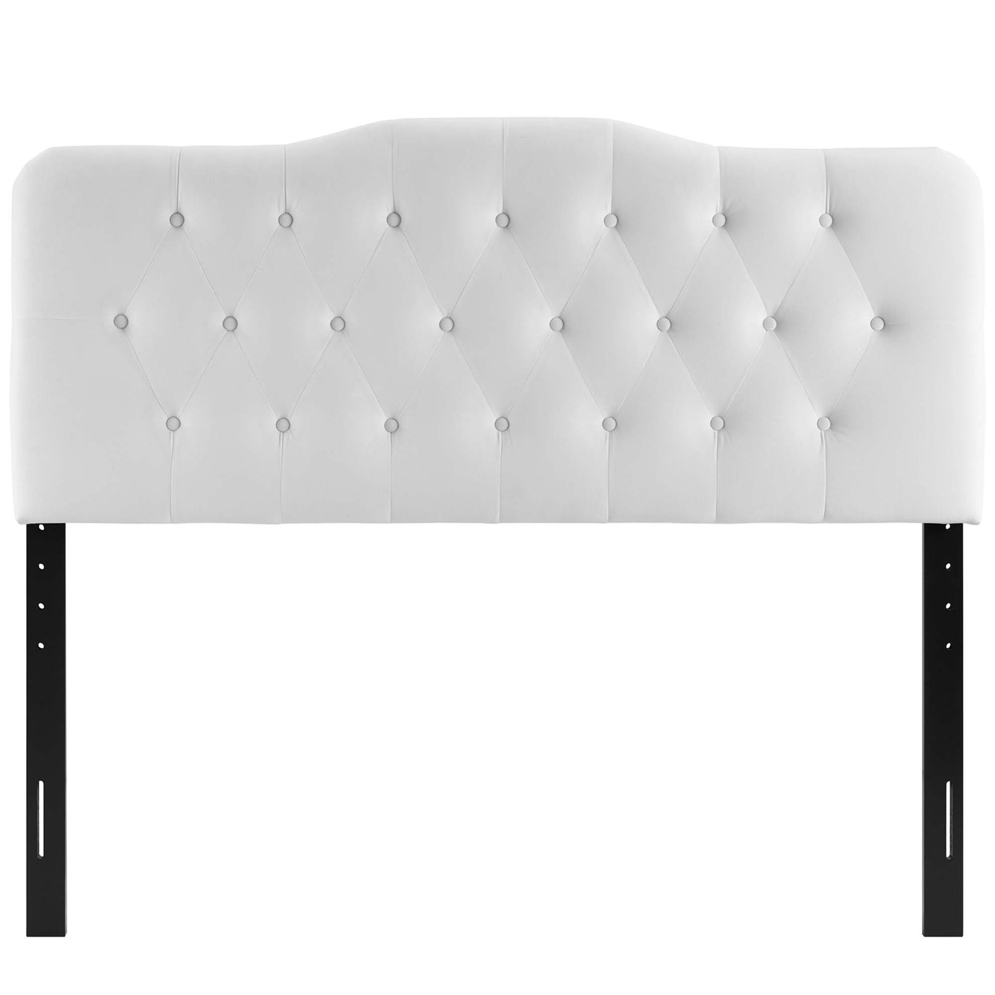 White upholstered tufted headboard with diamond pattern and curved top on black metal legs.