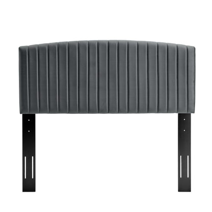 Dark gray velvet upholstered headboard with vertical channel tufting & black metal legs.