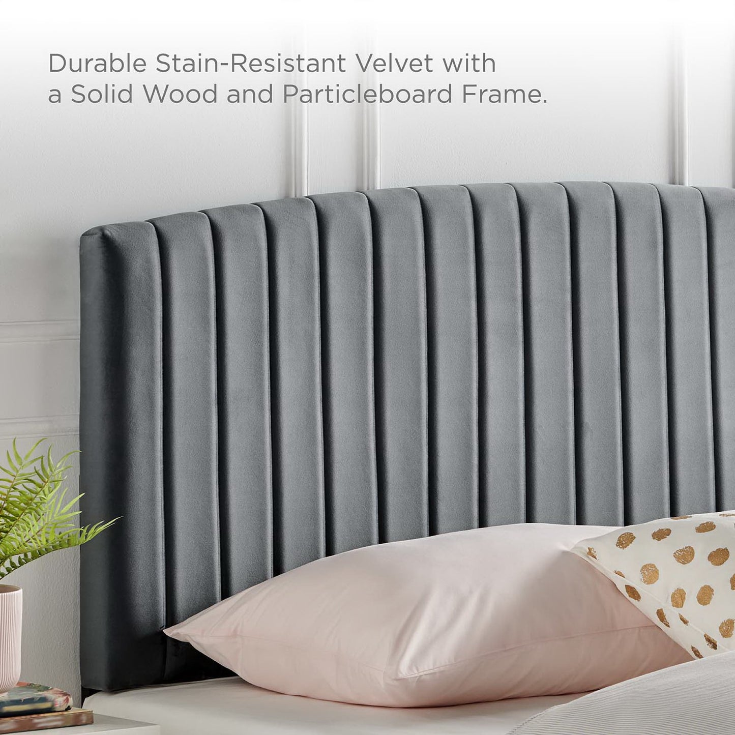 Charcoal velvet, vertical channel tufted twin headboard on a solid wood & particleboard frame.