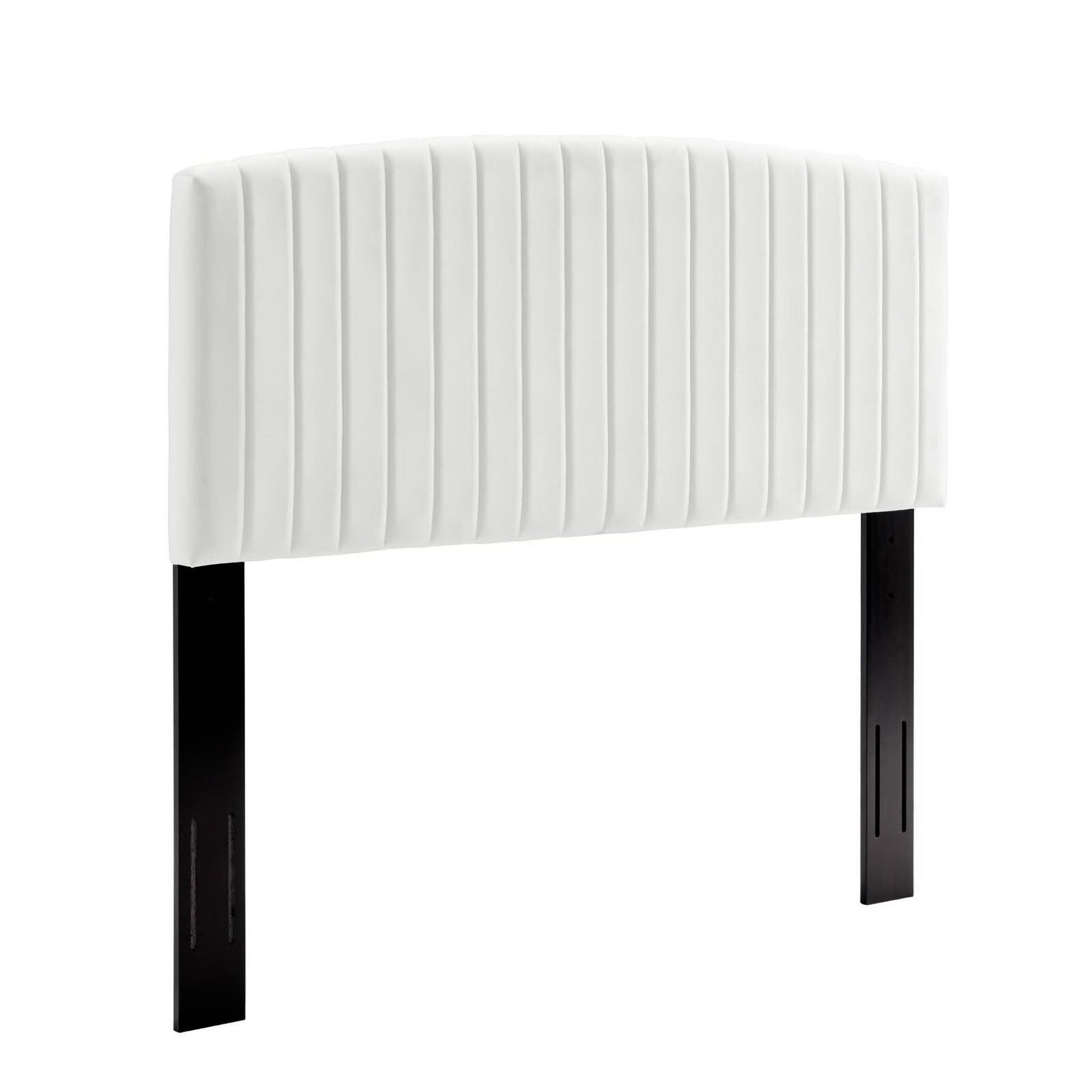 Curved white padded headboard with vertical channel stitching, supported by black rectangular legs.