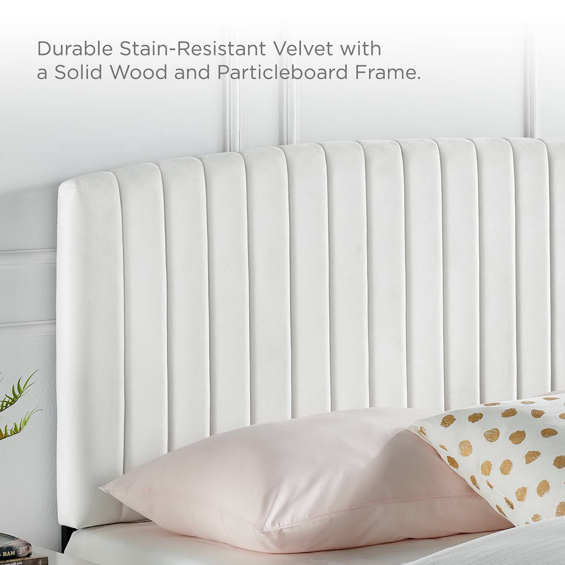 White velvet upholstered twin headboard with vertical channel tufting.