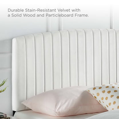 White velvet upholstered twin headboard with vertical channel tufting.