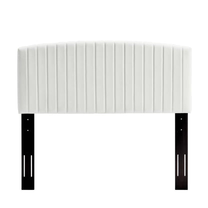 White quilted upholstered headboard with vertical channel tufting, supported by black metal legs.