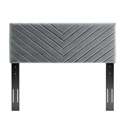 Grey angular channel-tufted upholstered headboard with black metal mounting brackets.