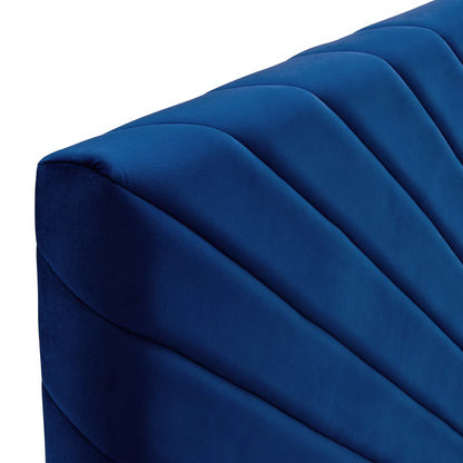 Navy blue performance velvet headboard with angular channel tufting.