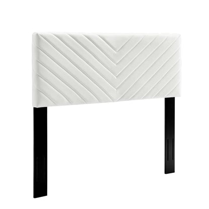 White padded headboard with angular channel tufting in performance velvet; two black rectangular legs for full/queen beds.