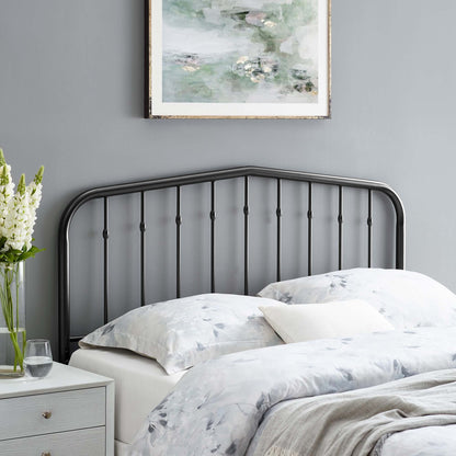 Black metal twin headboard with an arched top and vertical rails.