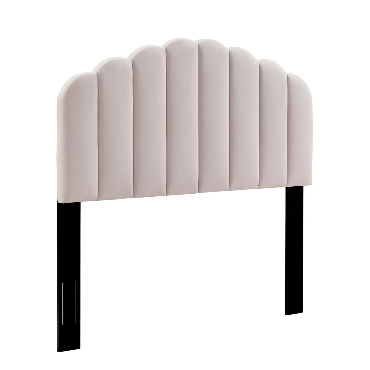 Pink padded twin headboard with scalloped vertical channels and black legs.
