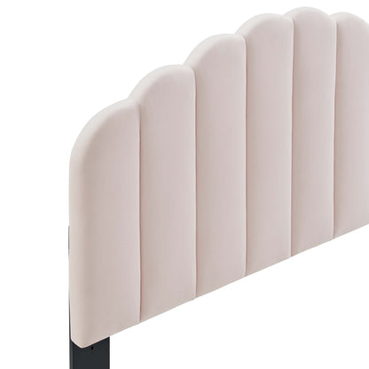 Pale pink upholstered twin headboard with vertical scalloped panels, soft fabric, modern glam bedroom accent.