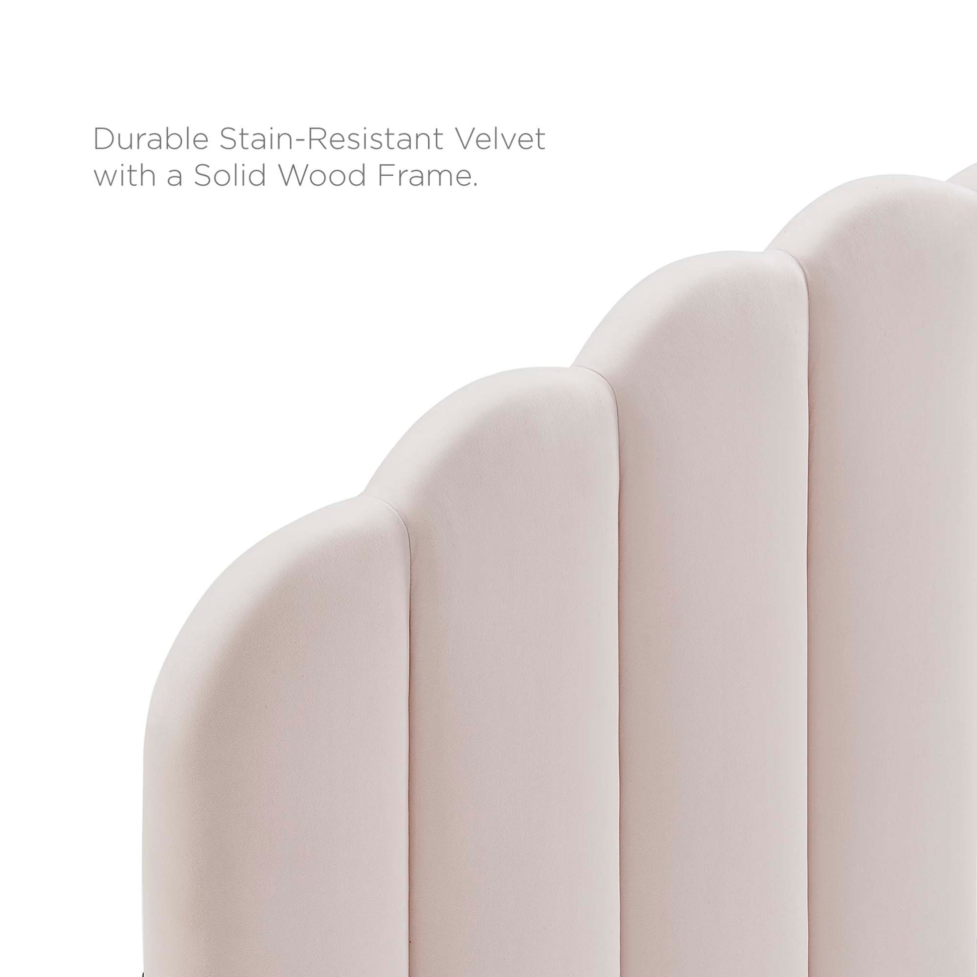 Soft pink velvet twin headboard with rounded vertical panel design; padded and suitable for a modern bedroom.