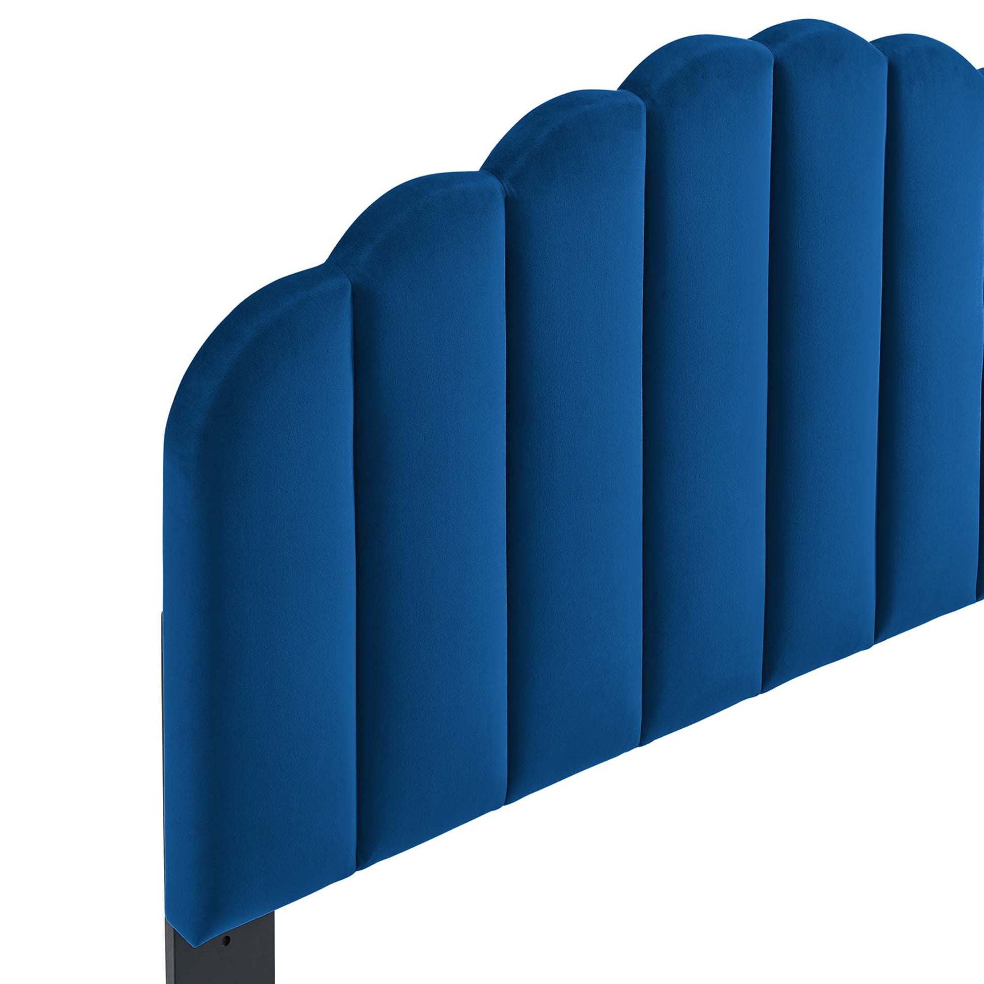Navy blue upholstered headboard with tall vertical rounded panels, modern padded bed accent.