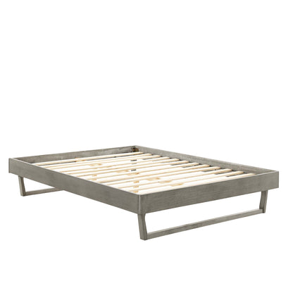 Gray platform bed frame with natural wood slats; low-profile rectangular design for a modern bedroom.