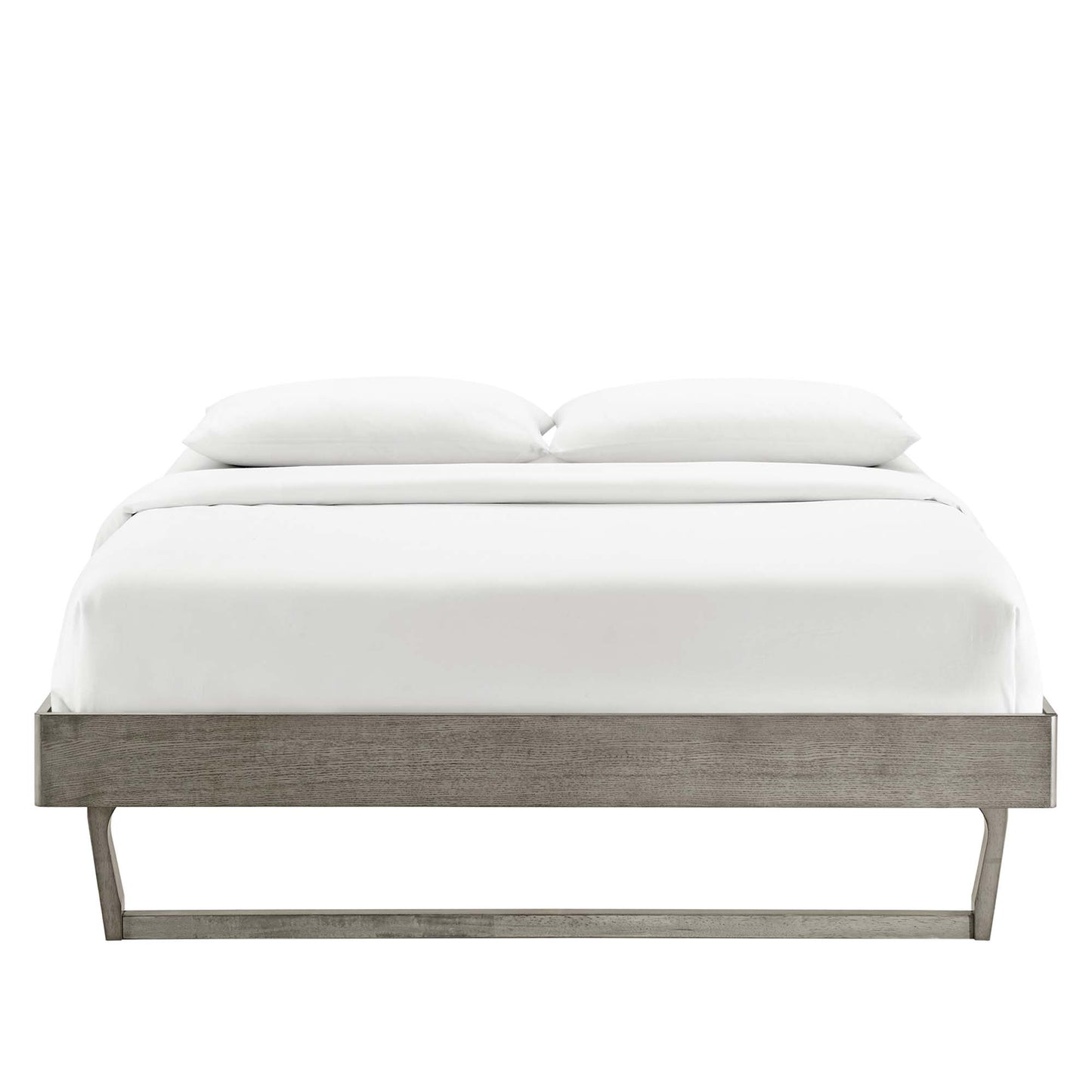 Grey wood platform bed with low-profile frame and angled legs, white bedding and two pillows.