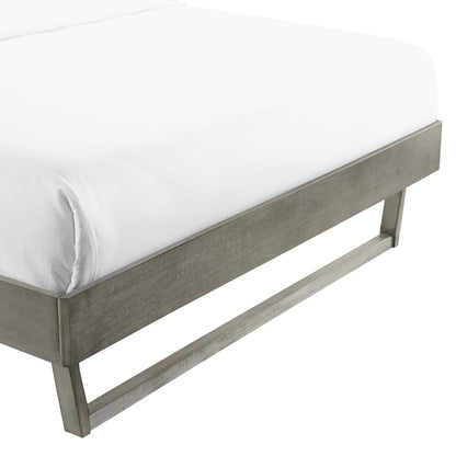 Gray weathered wood king platform bed frame with a low-profile silhouette.