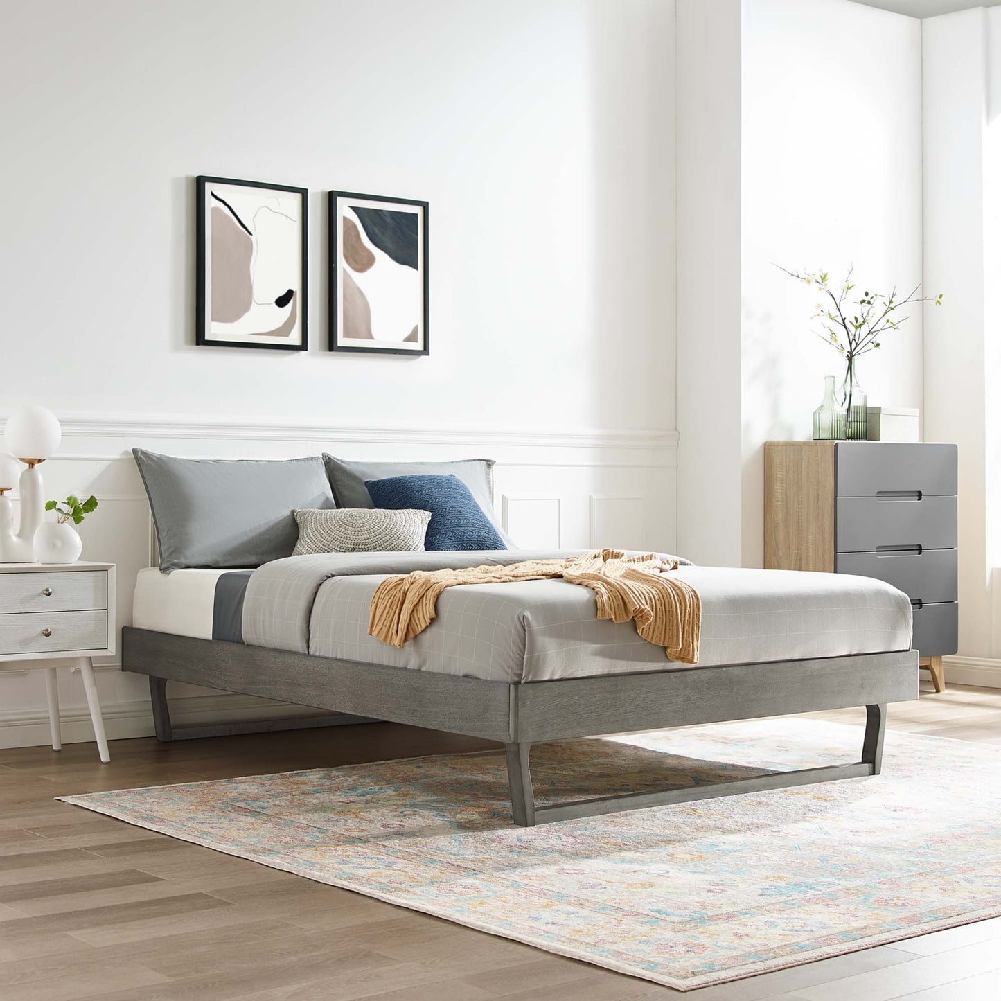 MOD-6215-GRY grey wood king platform bed frame with a low-profile design in a modern bedroom, neutral bedding and a tan throw.