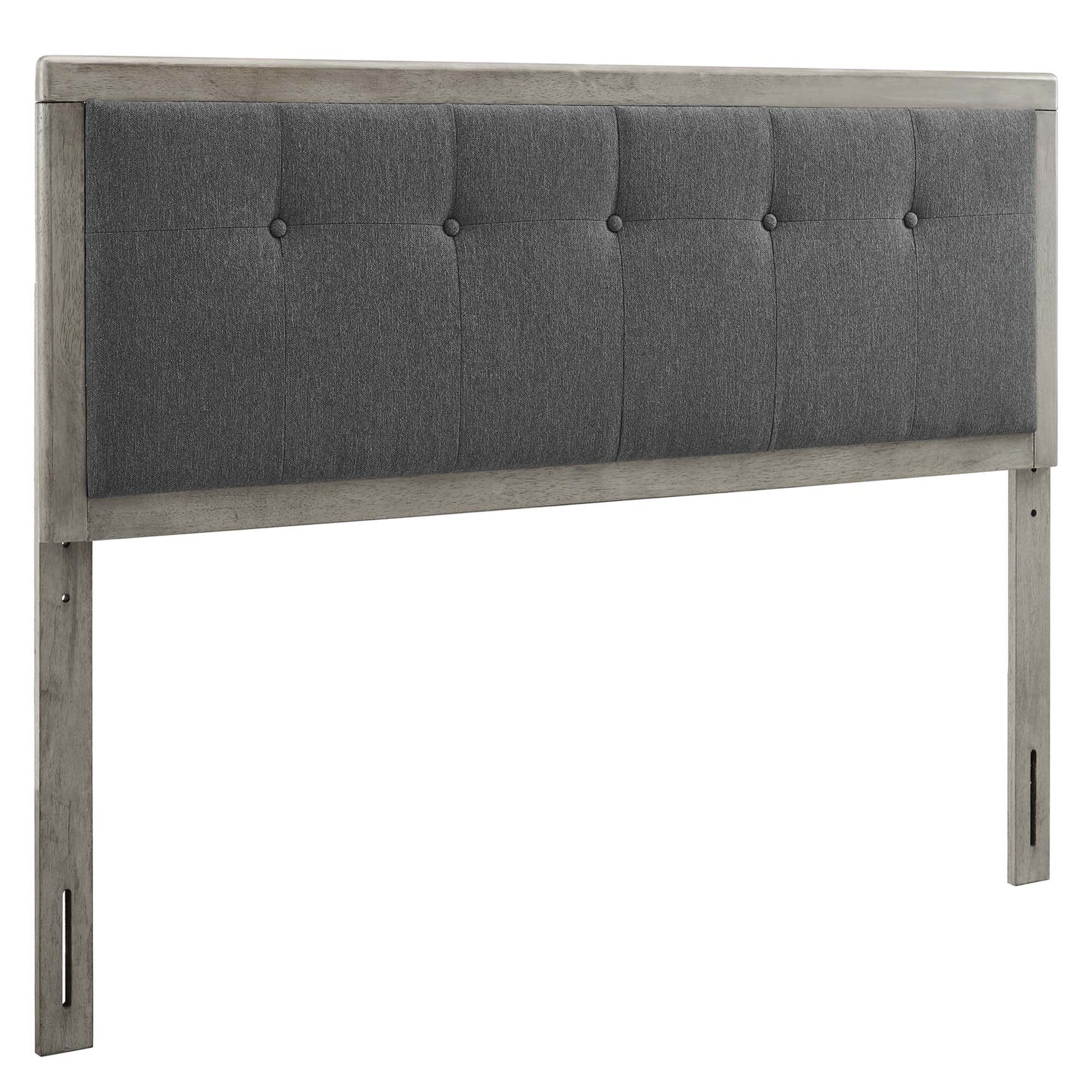 Grey button-tufted fabric headboard with a weathered gray wood frame and tall posts.
