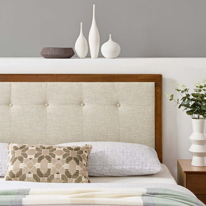 Brown-framed beige tufted king headboard with a geometric pillow, pastel throw, and white ceramic vases on a shelf beside the bed.