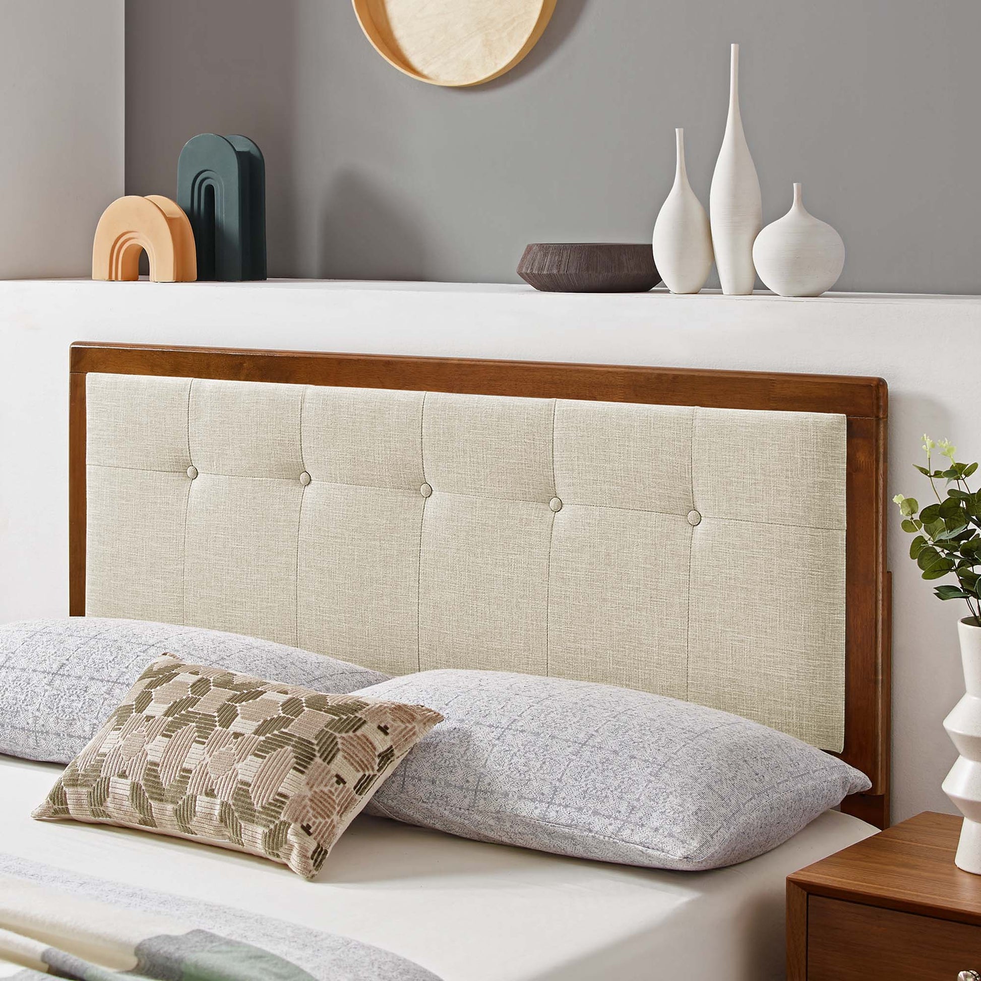 Tufted beige fabric and wood headboard with a brown walnut finish, designed for a king-size bed.