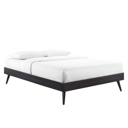 Black wood full platform bed frame with tapered legs and white bedding.
