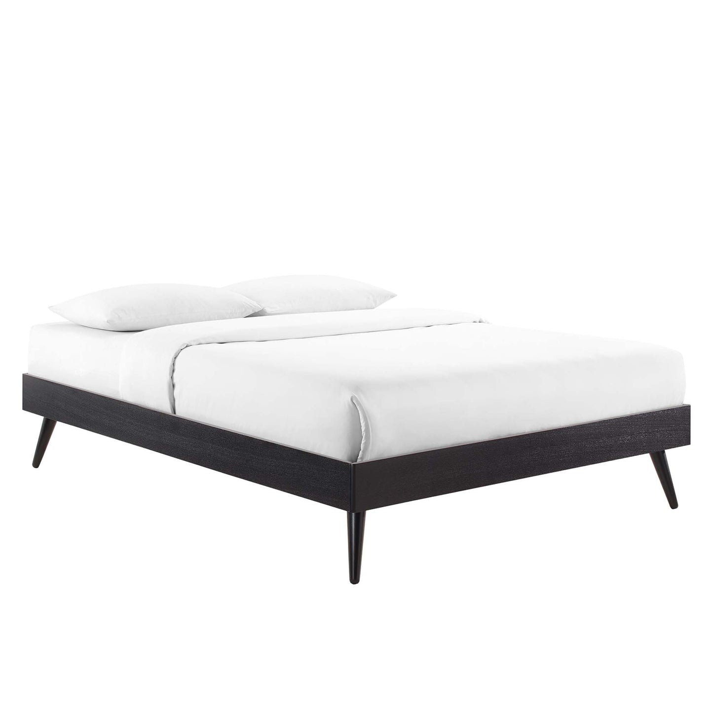 Black wood platform bed with tapered legs and white bedding for a modern minimalist look.