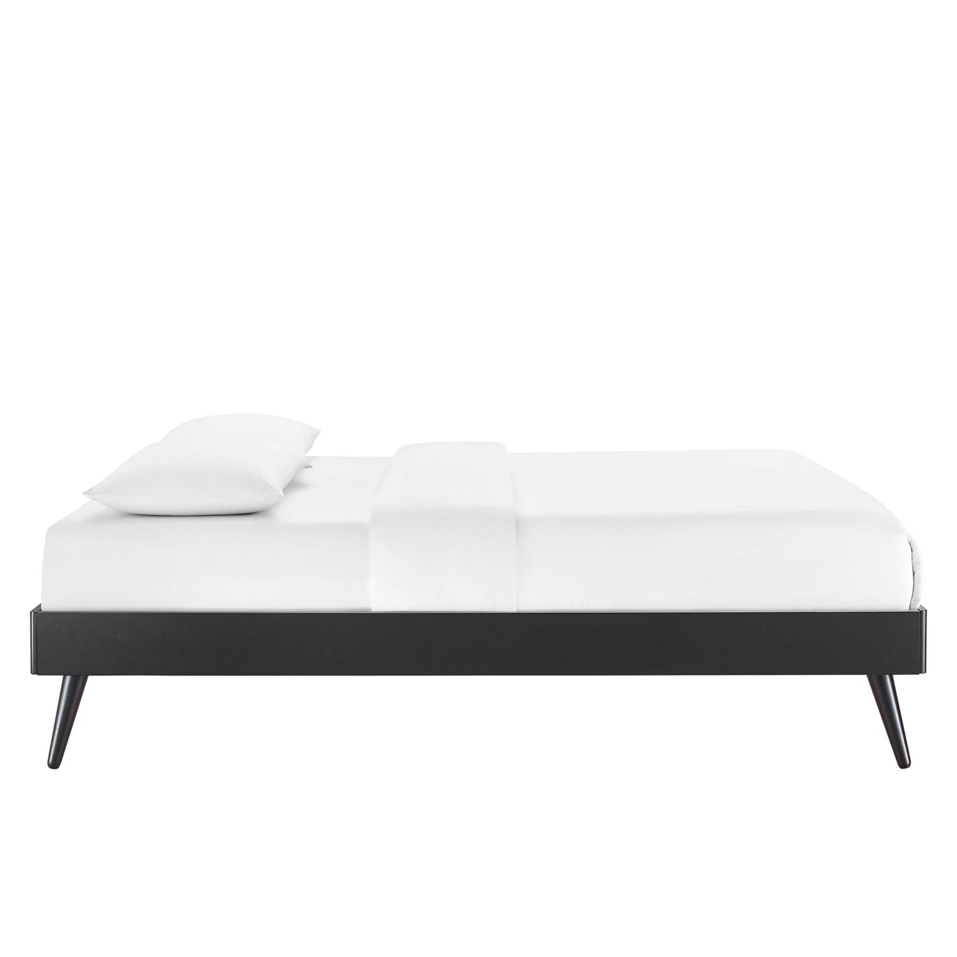 Black wood king platform bed frame with tapered legs and white bedding, modern minimalist bedroom.
