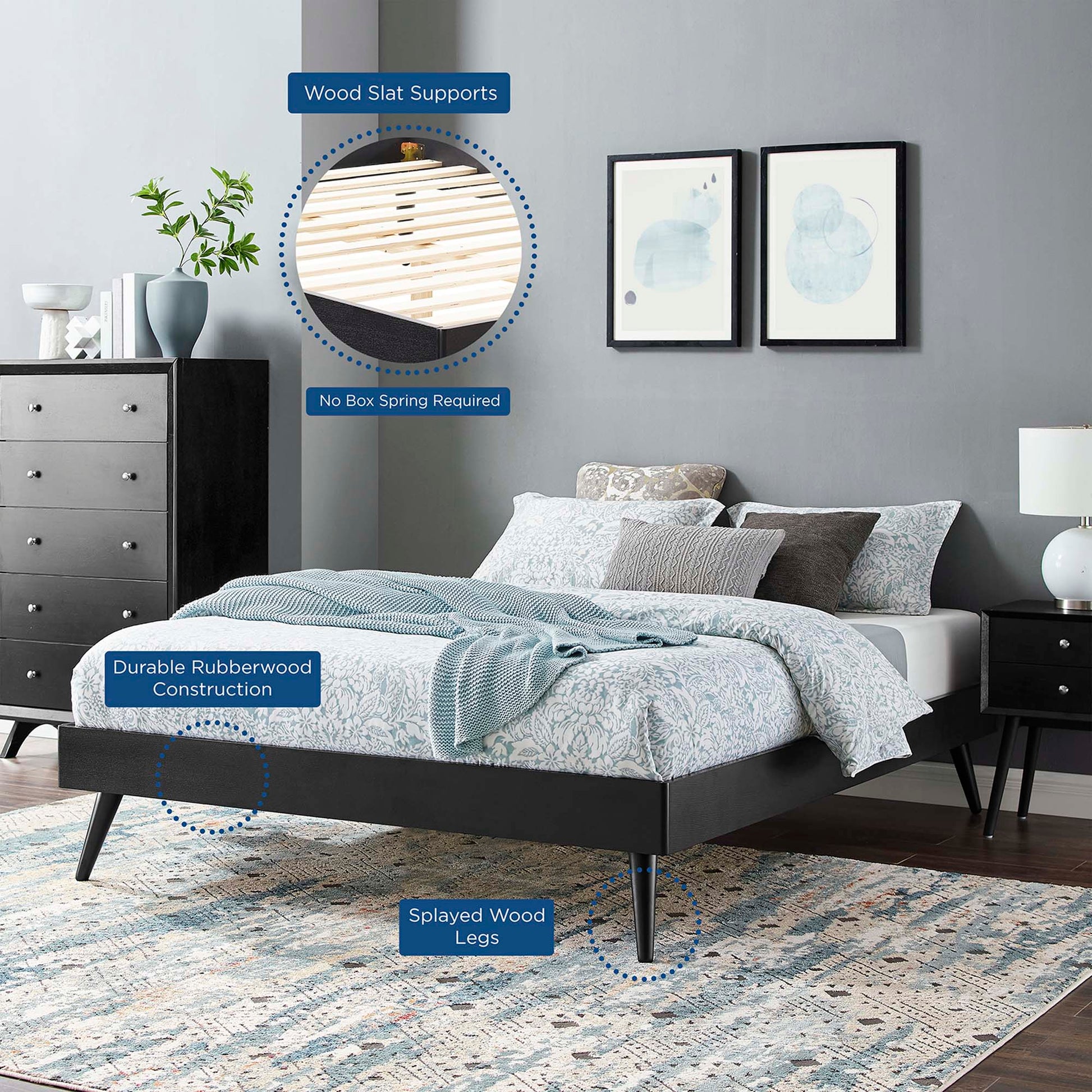 Black platform bed with splayed rubberwood legs and blue bedding; wooden slat supports, no box spring needed.