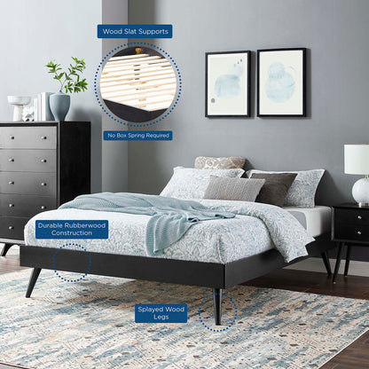 Black platform bed with splayed rubberwood legs and blue bedding; wooden slat supports, no box spring needed.