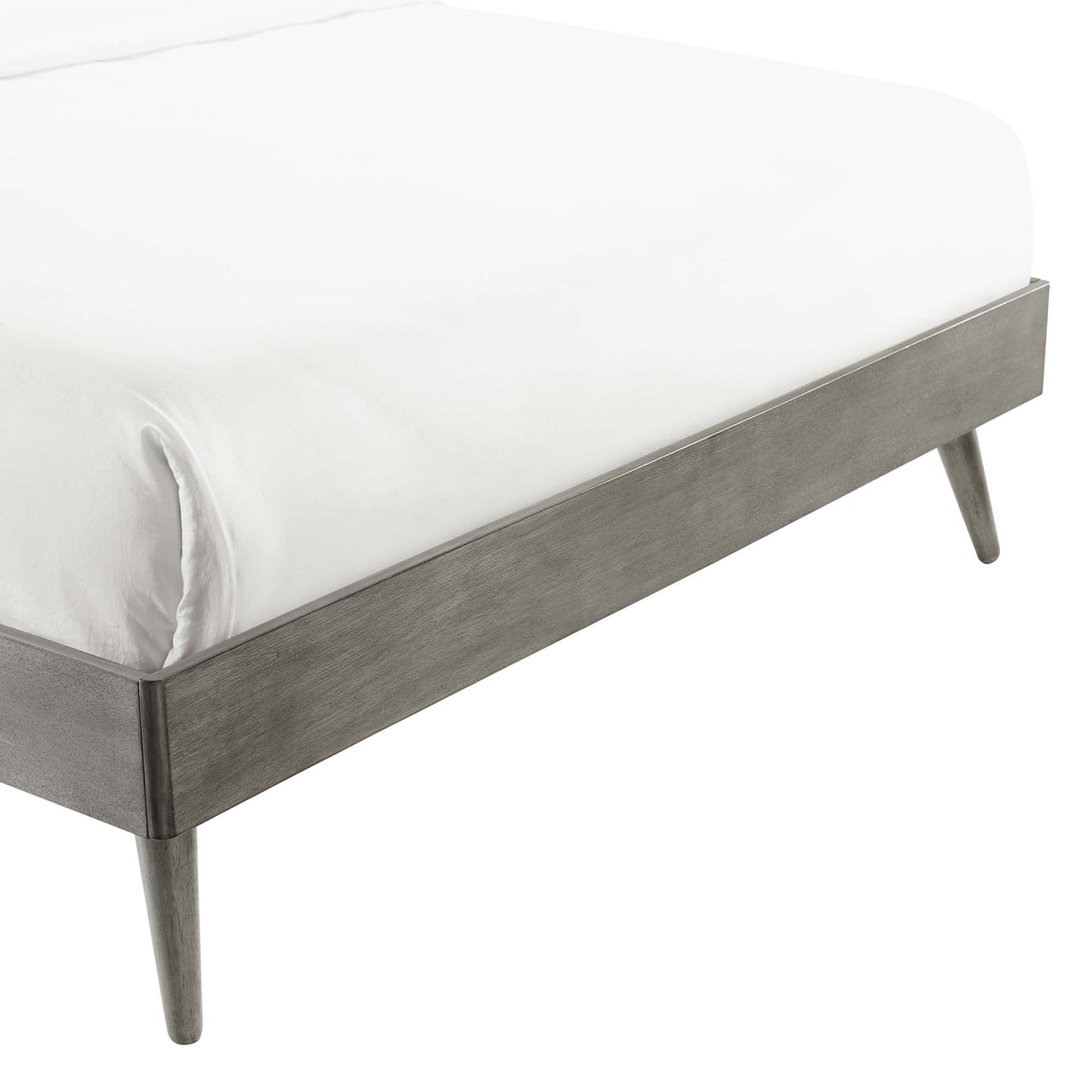 Grey wood king platform bed frame with tapered legs and white mattress.
