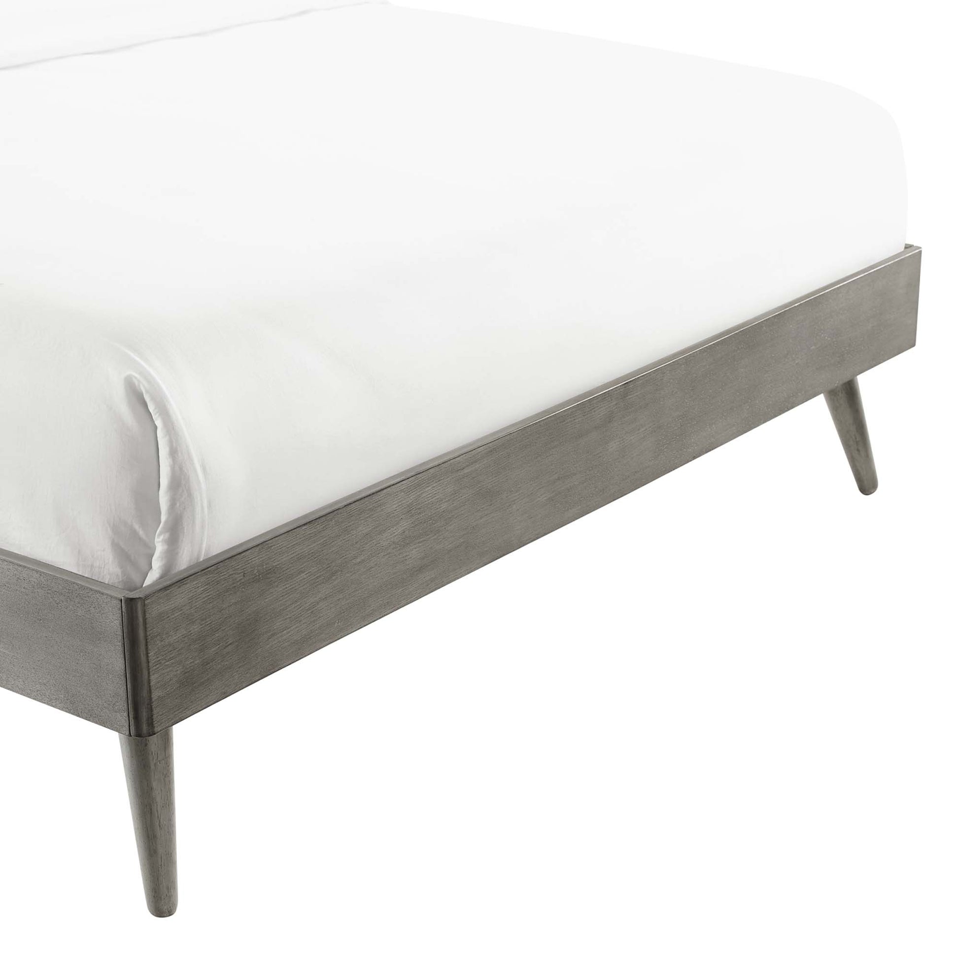 Grey wood king platform bed frame with tapered legs and white mattress.