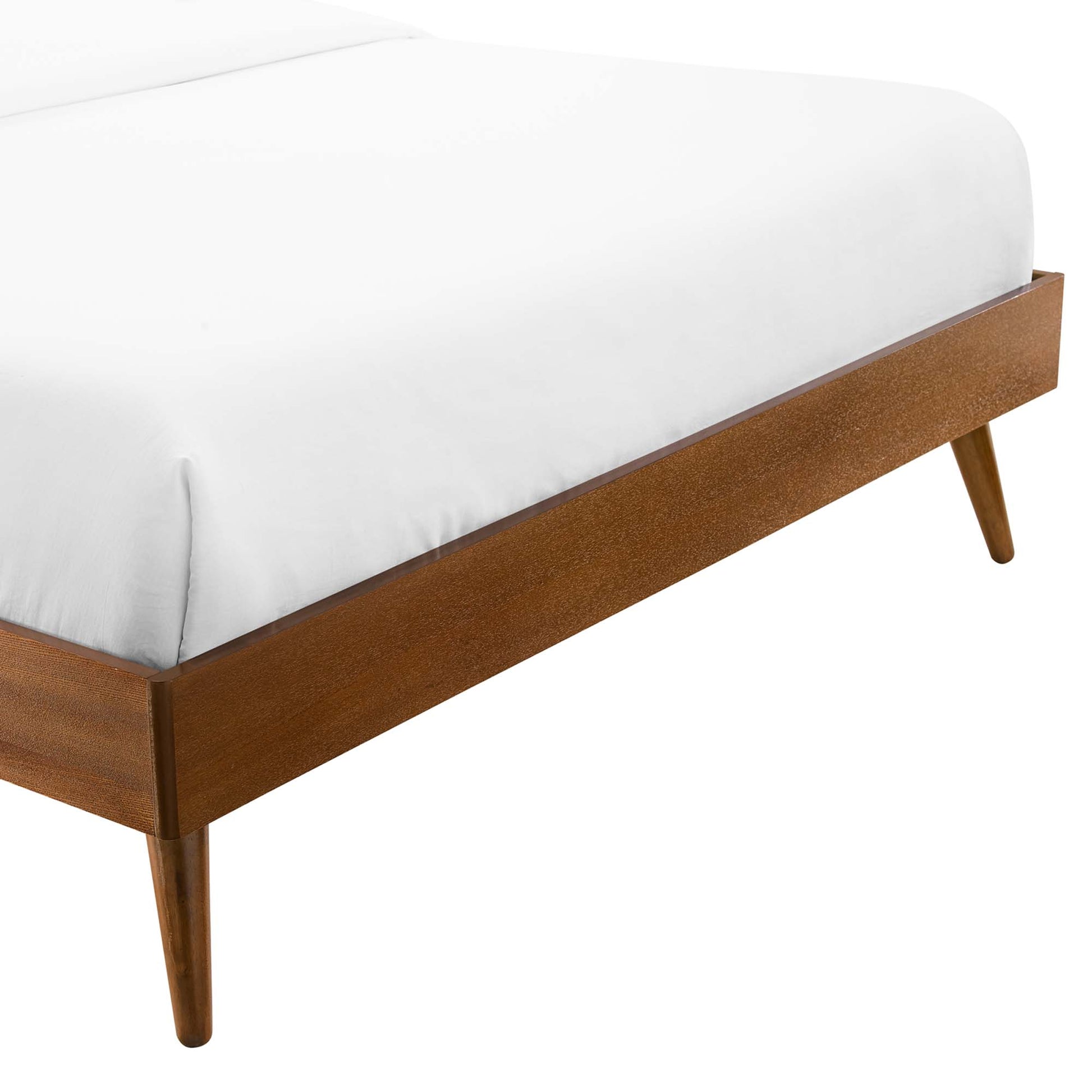 Walnut platform bed frame; low-profile, mid-century design with tapered legs.