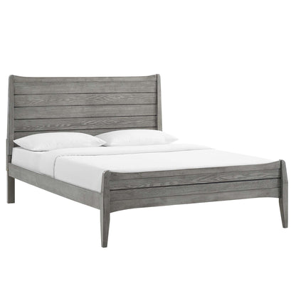 Gray weathered wood King platform bed with tall slatted headboard and slightly curved footboard, white bedding.