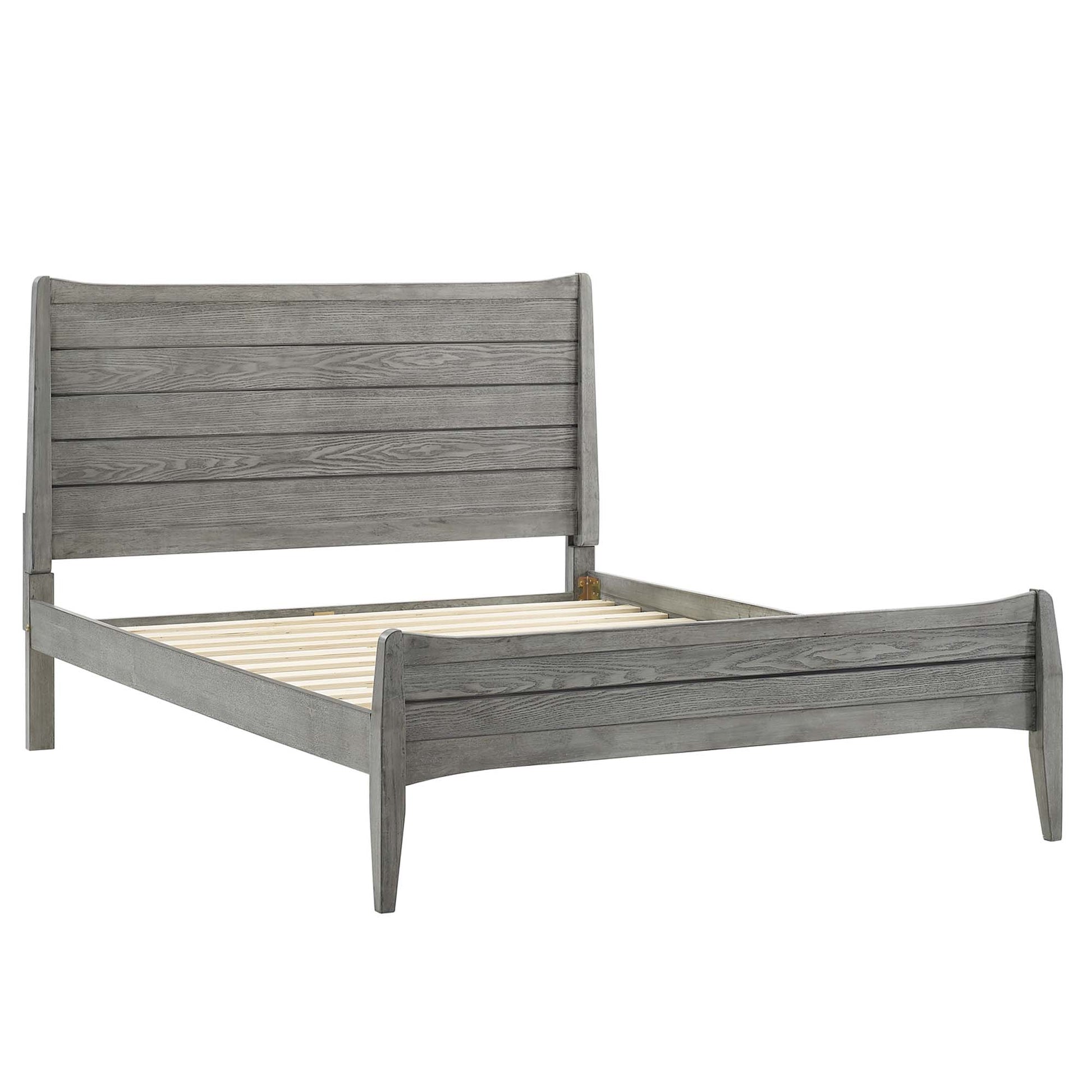 Gray weathered wood king platform bed with slatted base, tall headboard & shorter footboard in rustic farmhouse style.