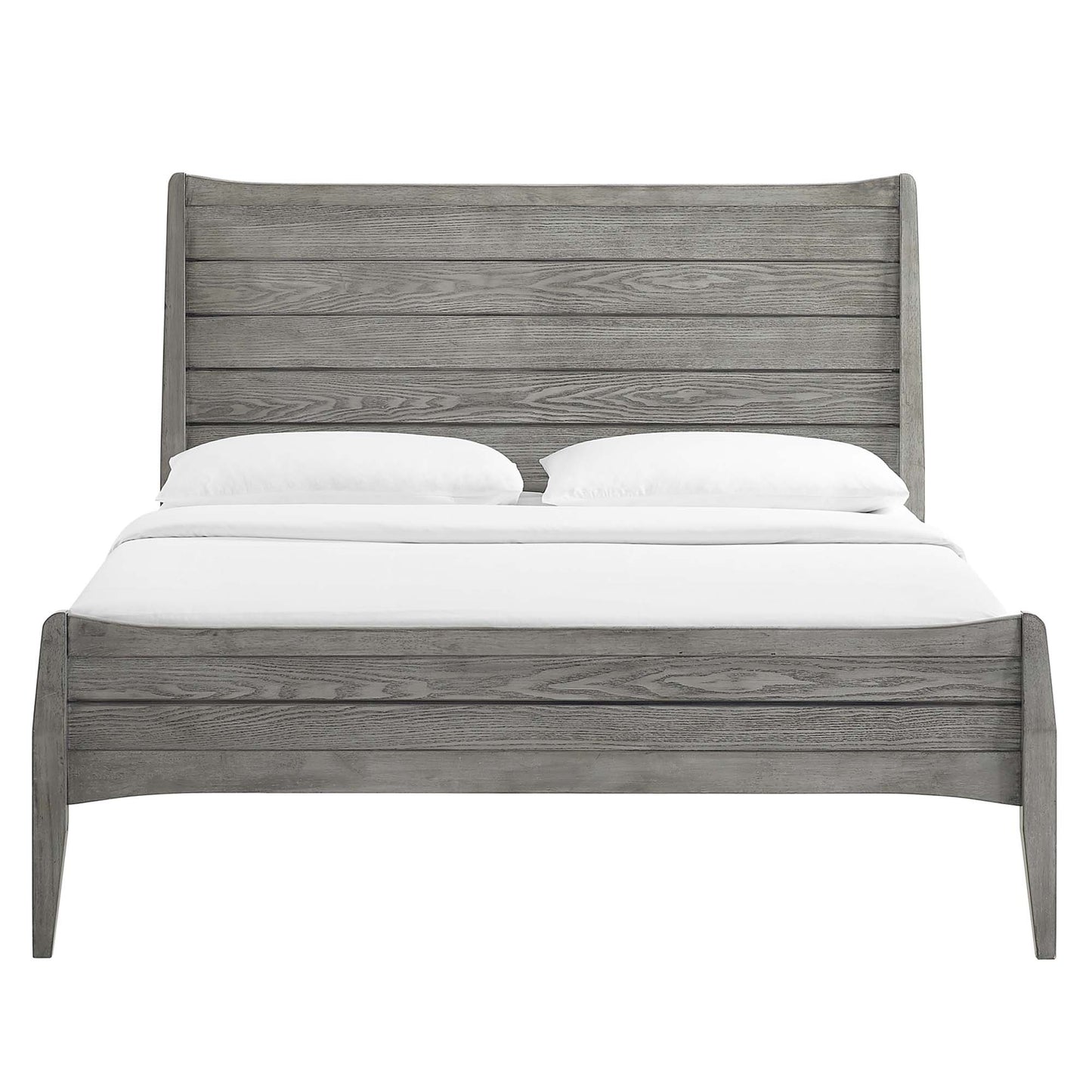 Weathered gray wooden bed with tall slatted headboard and curved footboard, rustic farmhouse bedroom centerpiece.