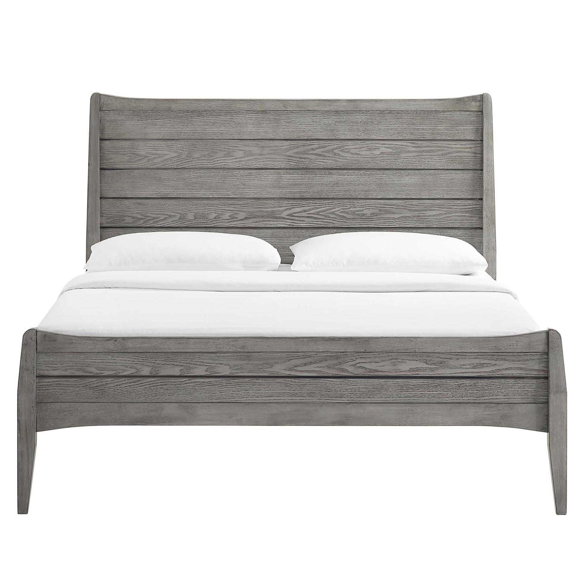 Weathered gray wooden bed with tall slatted headboard and curved footboard, rustic farmhouse bedroom centerpiece.
