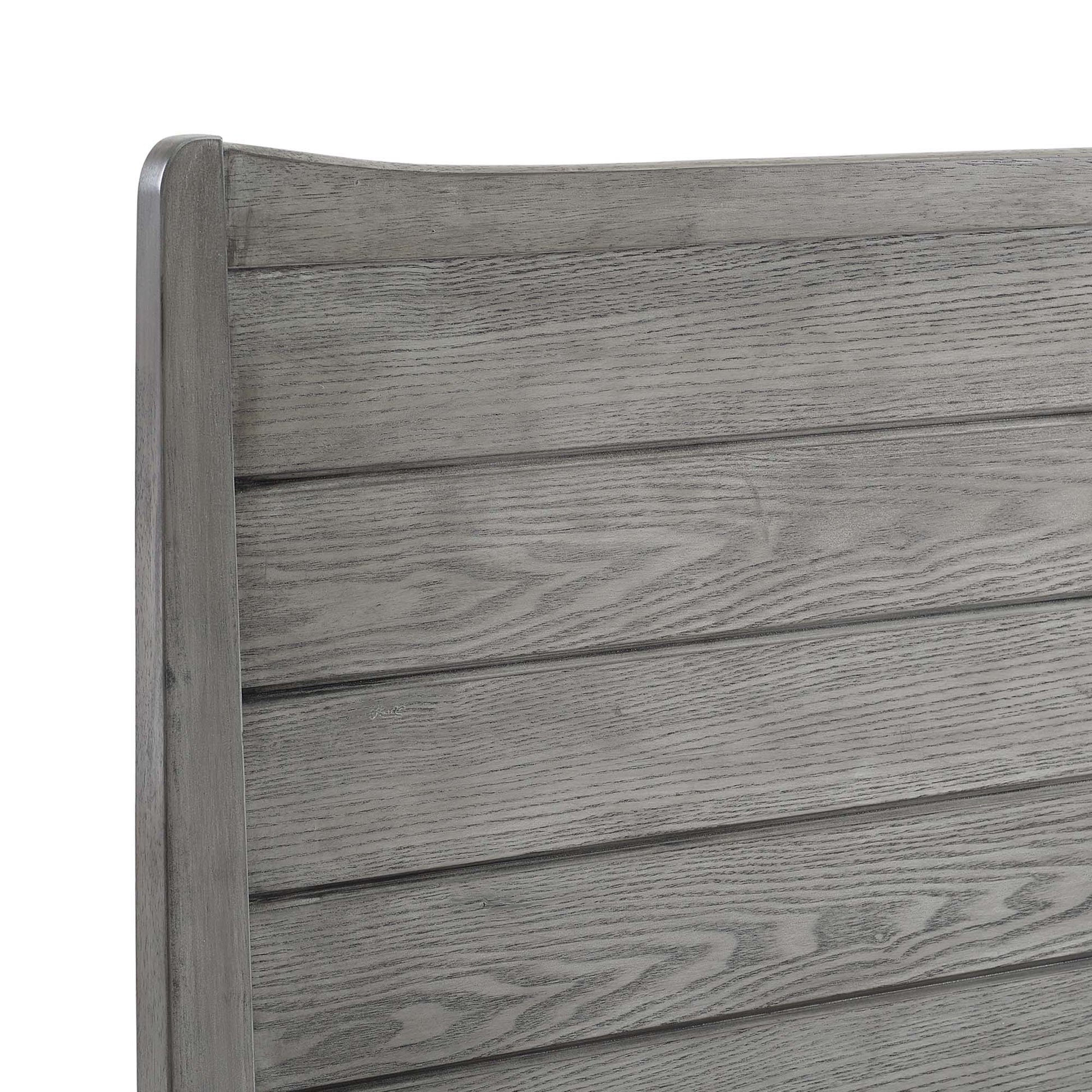 Gray weathered wood headboard panel with horizontal slats and a rounded vertical post on the left.