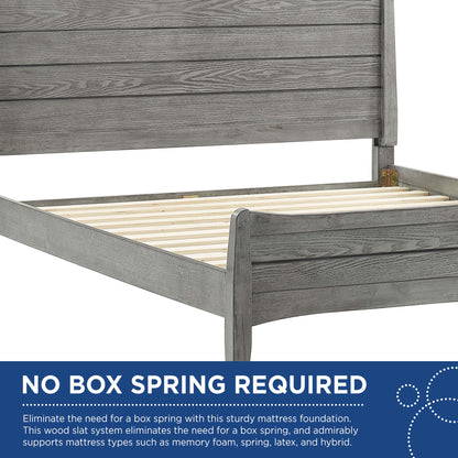 Gray-washed wooden platform bed with tall paneled headboard and visible slatted base.