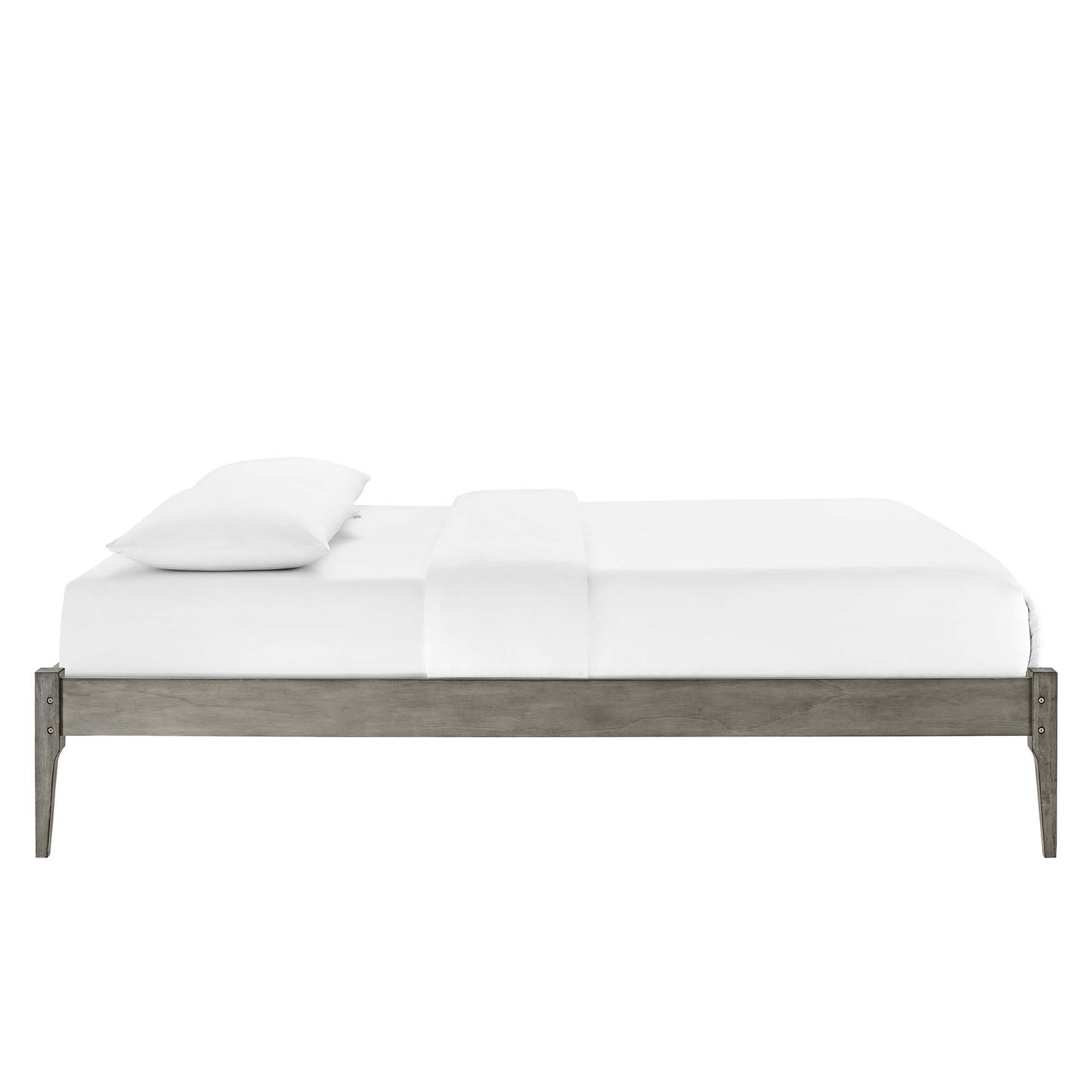 Full platform bed frame in gray weathered wood with white sheets and two pillows.