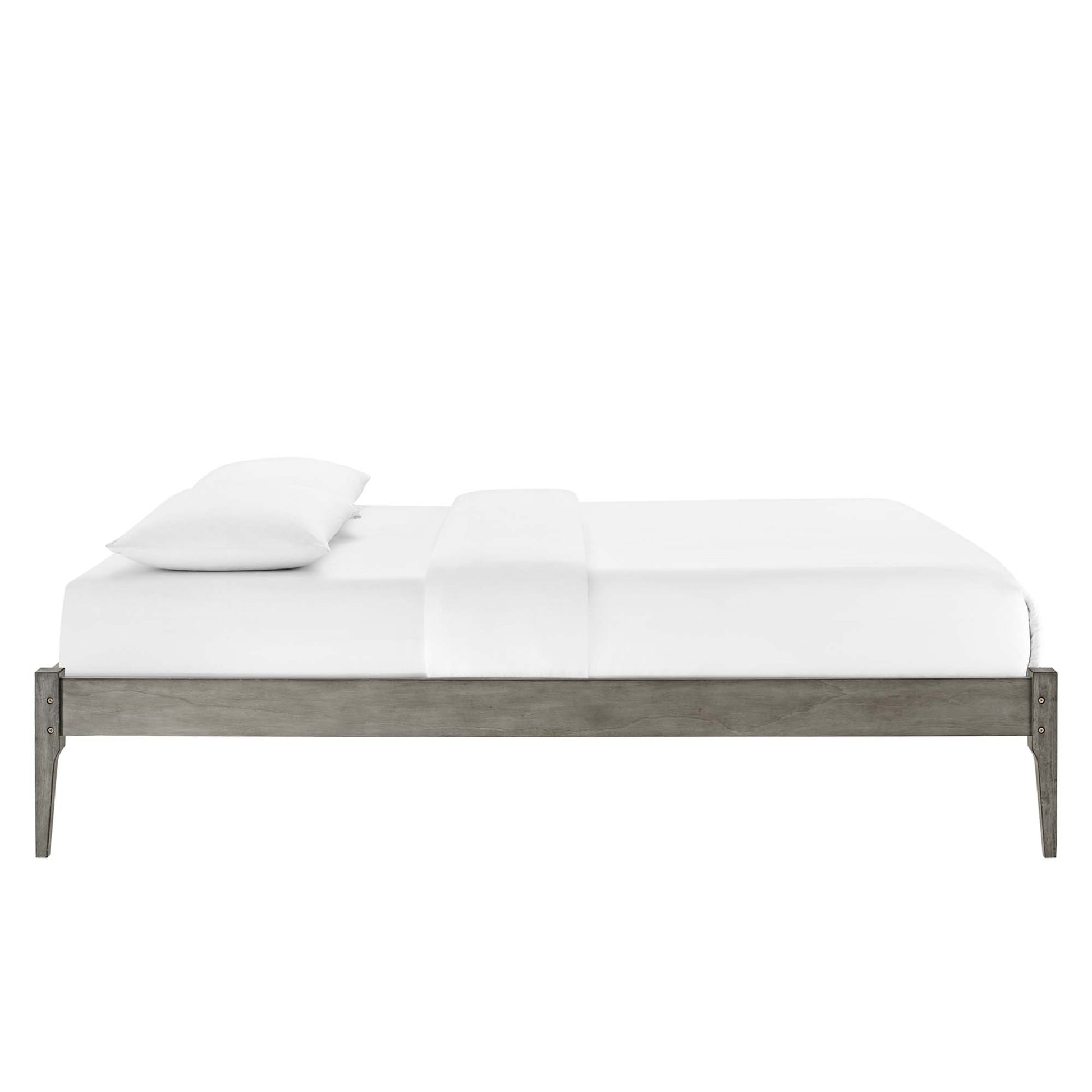 Full platform bed frame in gray weathered wood with white sheets and two pillows.