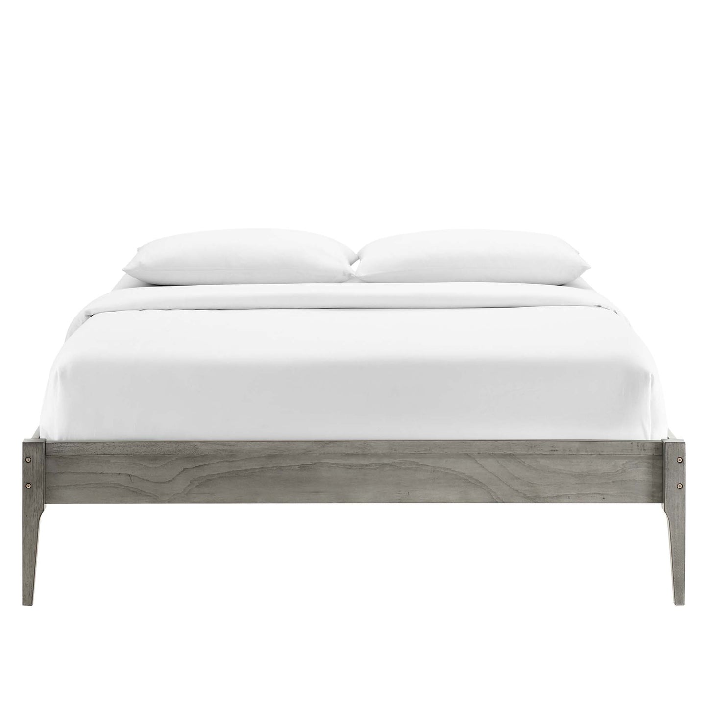 Gray-washed wooden platform bed with white bedding and two pillows.