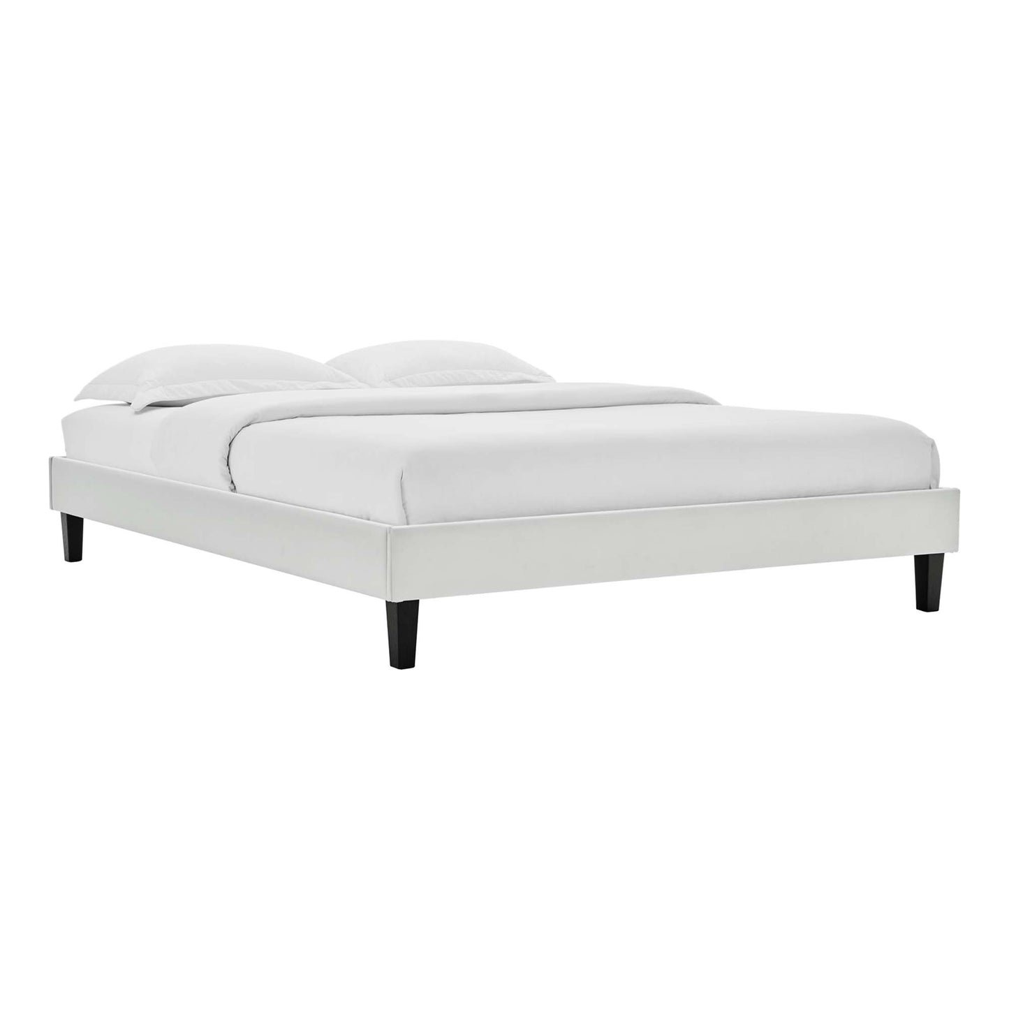 Light gray upholstered platform bed with white bedding, low-profile frame and black tapered legs.
