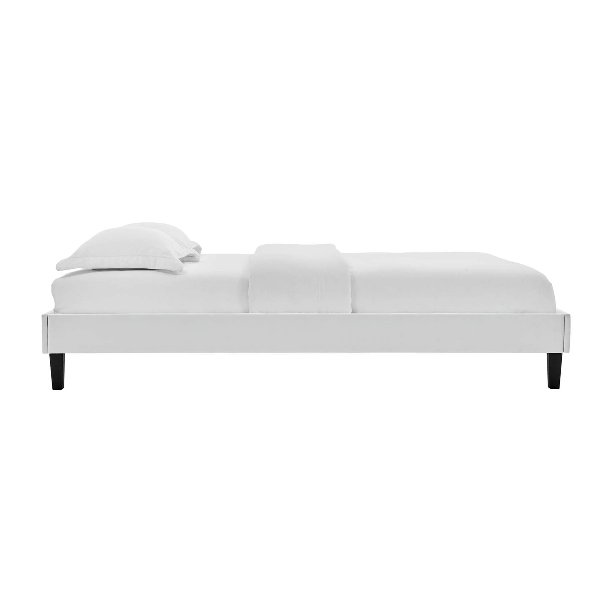 Gray velvet twin platform bed frame with a low-profile silhouette, white bedding and a light throw.