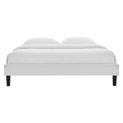 Gray velvet twin platform bed frame with a low-profile silhouette, black tapered legs, and white bedding.