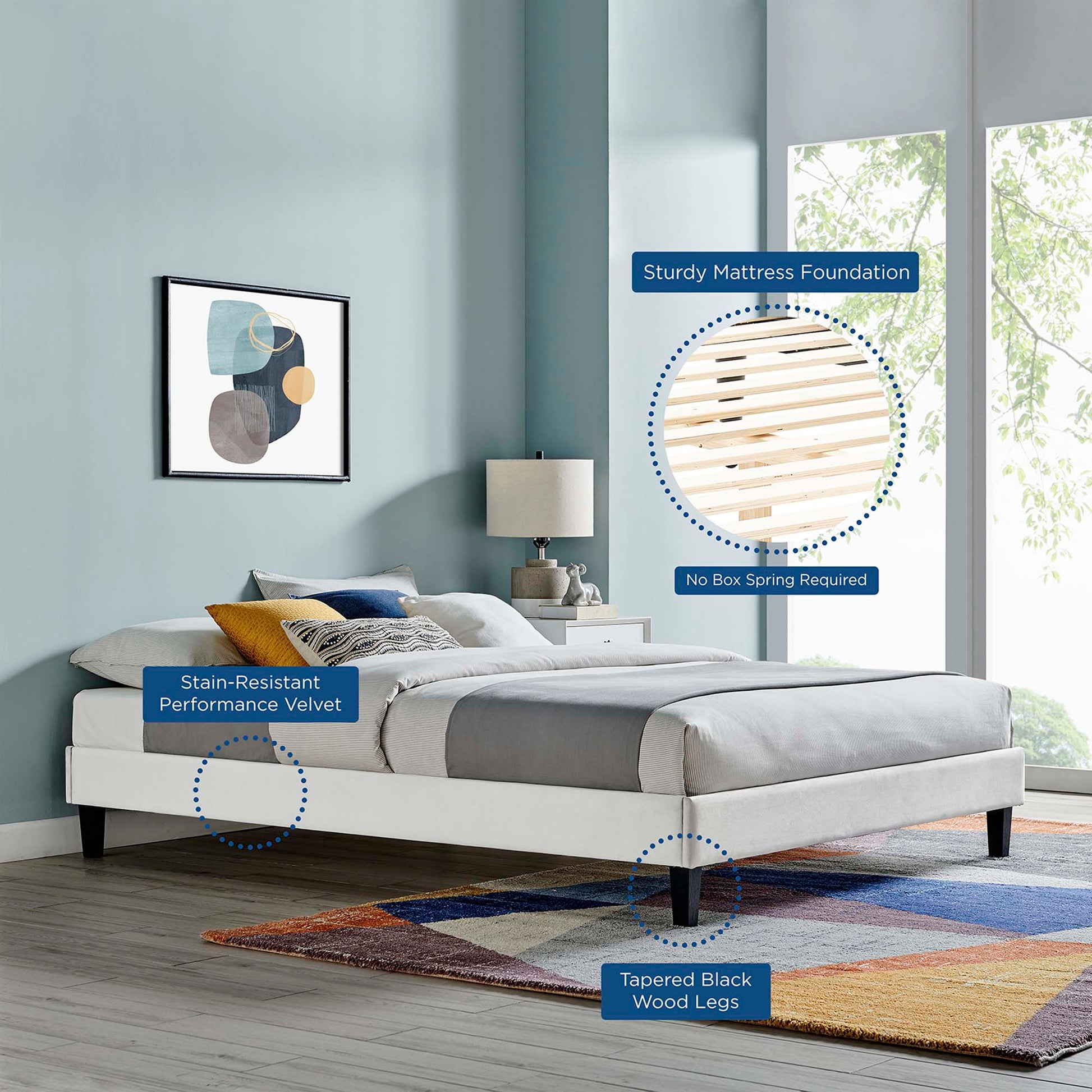 Modern platform bed in light gray stain-resistant velvet with tapered black wood legs; no box spring required.
