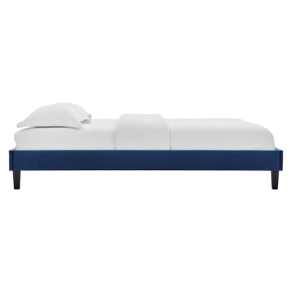 Navy blue full-size platform bed frame, low-profile, in a modern minimalist bedroom.