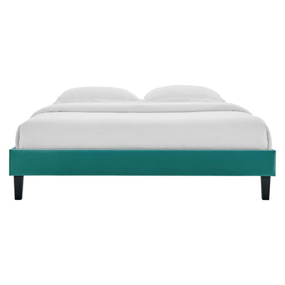 Teal upholstered full platform bed frame with white bedding and dark tapered legs, modern minimalist style.