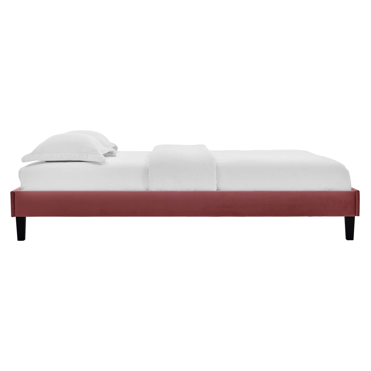 Red velvet queen platform bed with a low-profile frame and white linens.