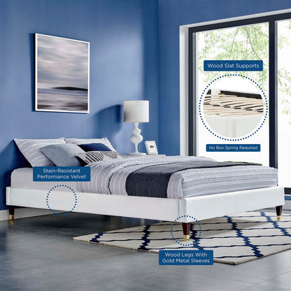 White twin platform bed frame with velvet upholstery and a low-profile design.