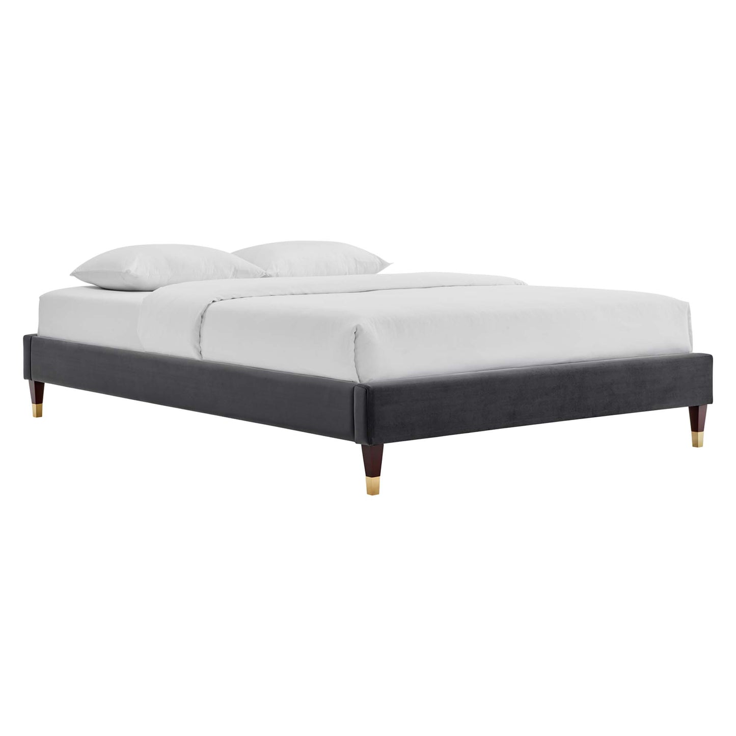 Charcoal gray upholstered king platform bed frame in modern style with white bedding and tapered legs with gold caps.