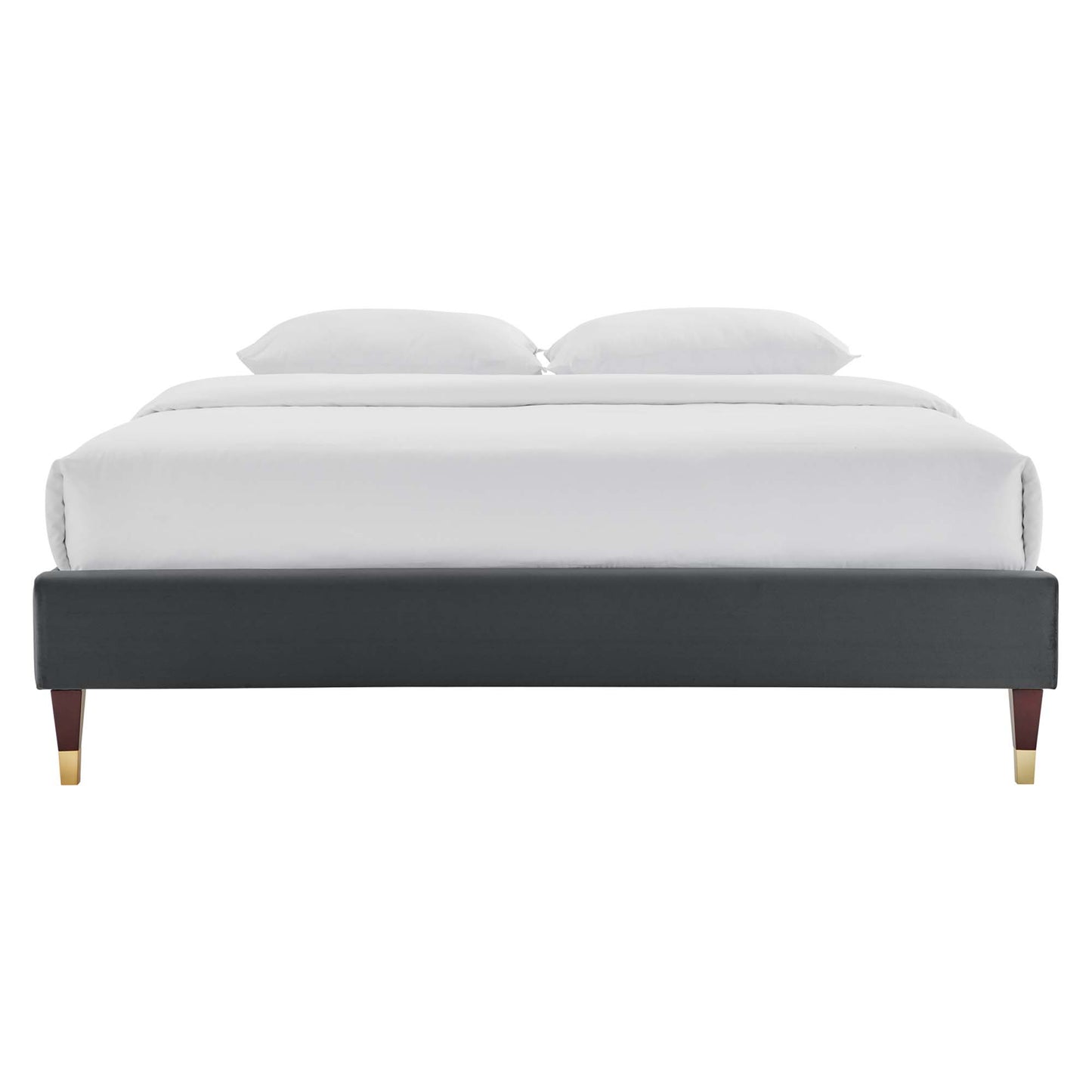 Charcoal velvet platform bed frame with gold-tipped legs and white bedding