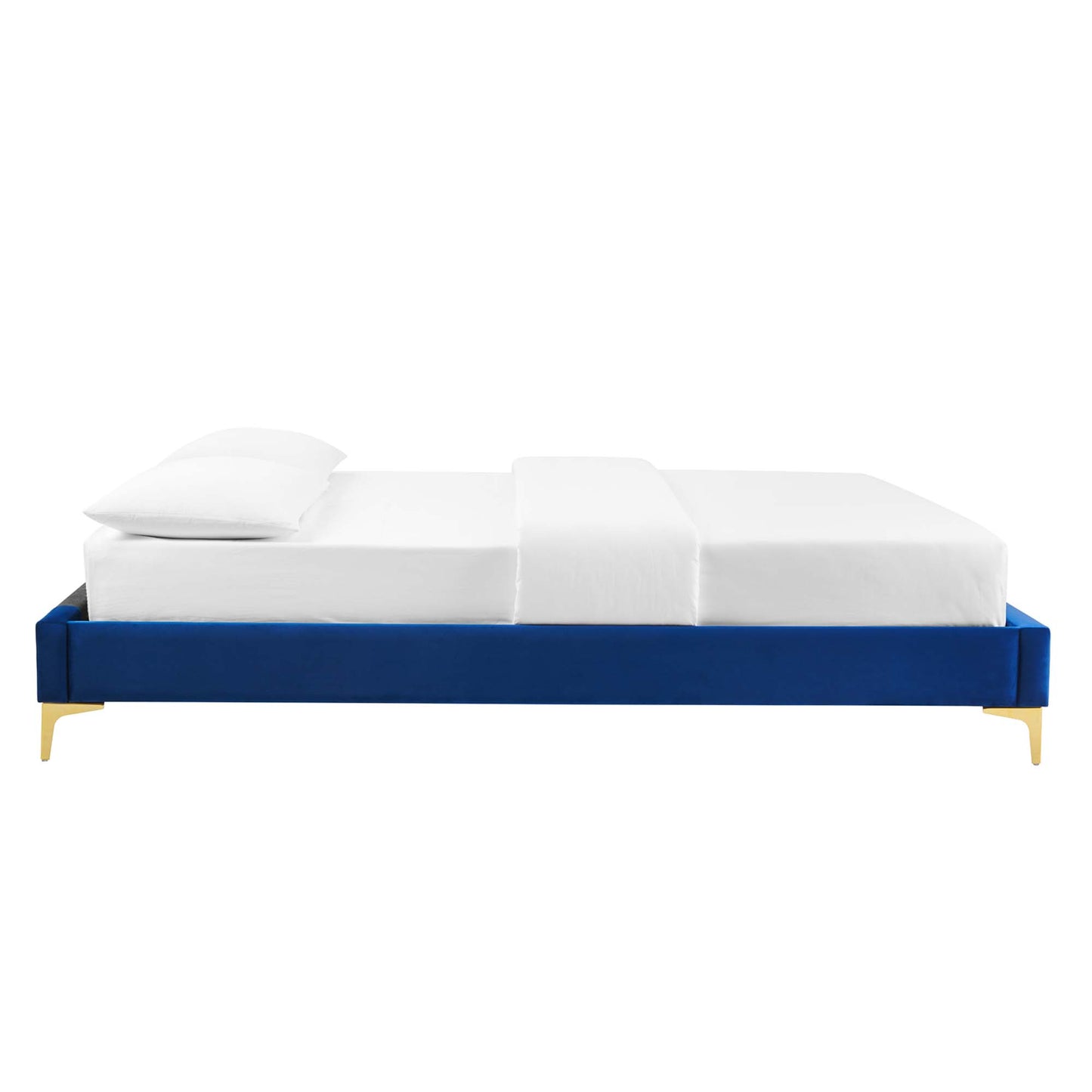 Navy blue velvet platform bed with gold legs, white mattress and pillow.